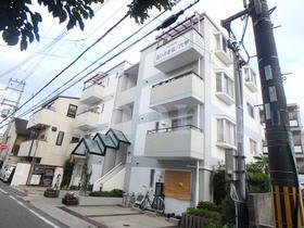 白い小さなマンション六甲 4階建