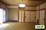 土崎港相染町字大谷地（上飯島駅）　１８００万円 LDKに続く10畳の和室は客間としても使えます。