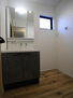 港北区日吉本町５丁目　新築一戸建て 洗面室は、しっかりとしたスペースを確保。上質な温かみを持つカラーで統一されています。ワイドな洗面台は収納力もありいつでもすっきりとした洗面室に。
