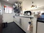 ロイヤルガーデン宇多津四番丁第２ 対面式のシステムキッチン。窓があり明るいキッチンです。